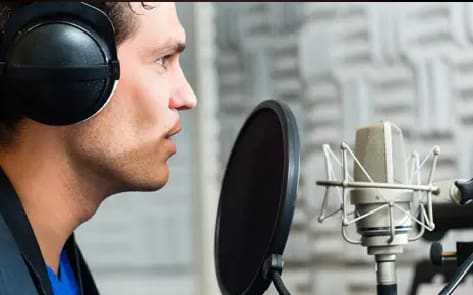 A man with headphones is listening to some music