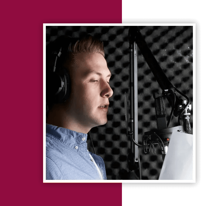 A man with headphones is recording in the studio.